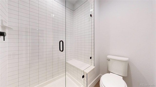 885 Delechant Dr, Erie, CO 80516 - full bathroom featuring a stall shower and toilet