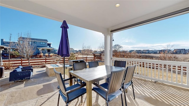 885 Delechant Dr, Erie, CO 80516 - balcony with a patio area, a fire pit, and outdoor dining space
