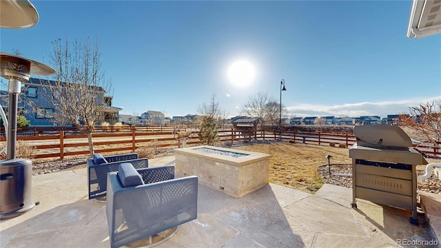 885 Delechant Dr, Erie, CO 80516 - view of patio / terrace with an outdoor fire pit, fence, and a grill