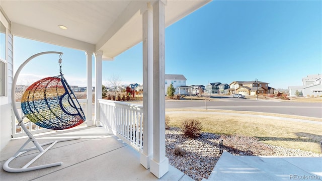 885 Delechant Dr, Erie, CO 80516 - view of patio / terrace featuring covered porch and a residential view