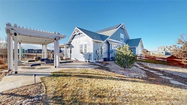 885 Delechant Dr, Erie, CO 80516 - exterior space featuring fence, a yard, a pergola, board and batten siding, and a patio area