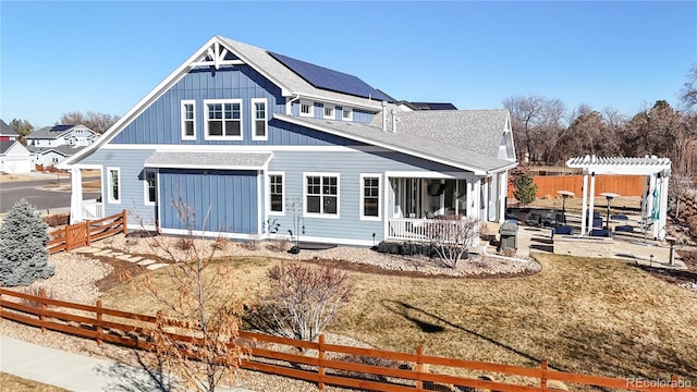 885 Delechant Dr, Erie, CO 80516 - back of house with fence private yard, a yard, roof with shingles, a pergola, and board and batten siding