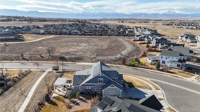 birds eye view of property with a residential view and a mountain view