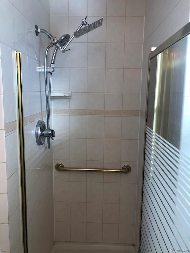 full bathroom with a shower stall