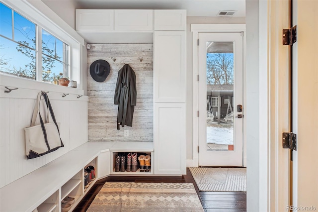 mudroom with a healthy amount of sunlight and visible vents