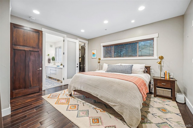 bedroom with recessed lighting, a spacious closet, baseboards, and wood finished floors