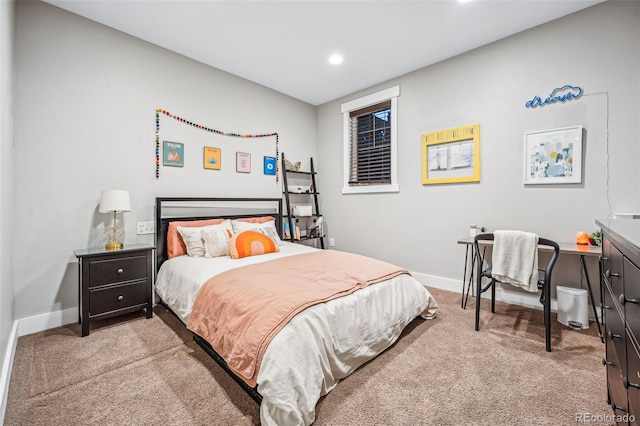 bedroom with light carpet, recessed lighting, and baseboards