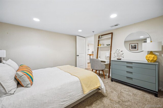 bedroom featuring recessed lighting, visible vents, and light colored carpet