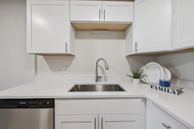 9380 E Center Ave Unit 8A, Denver, CO 80247 - kitchen featuring dishwasher, white cabinetry, and light countertops