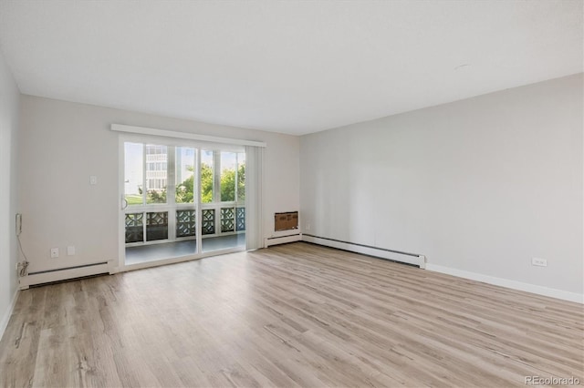 9380 E Center Ave Unit 8A, Denver, CO 80247 - spare room with a baseboard heating unit and wood finished floors