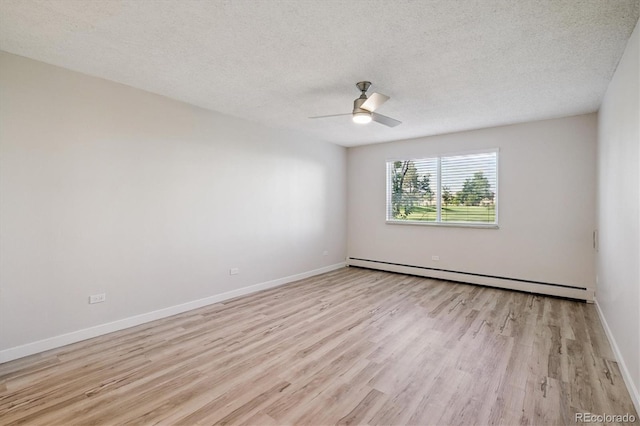 9380 E Center Ave Unit 8A, Denver, CO 80247 - spare room with baseboard heating, light wood-style flooring, a textured ceiling, and a ceiling fan