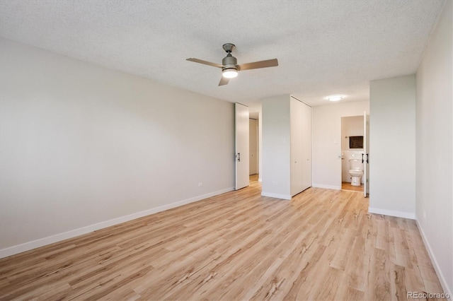 9380 E Center Ave Unit 8A, Denver, CO 80247 - spare room featuring light wood-type flooring, ceiling fan, and a textured ceiling