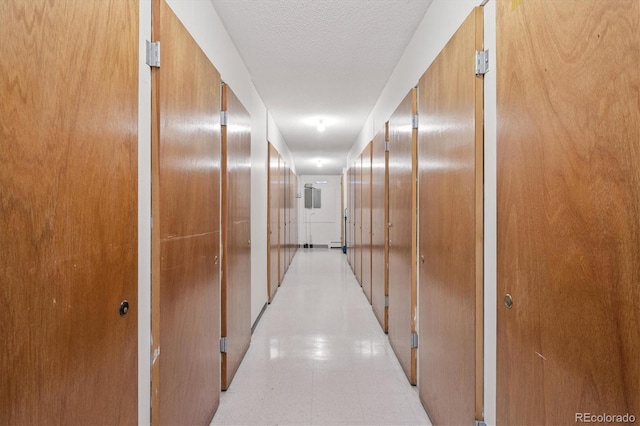 9380 E Center Ave Unit 8A, Denver, CO 80247 - corridor with light floors and a textured ceiling