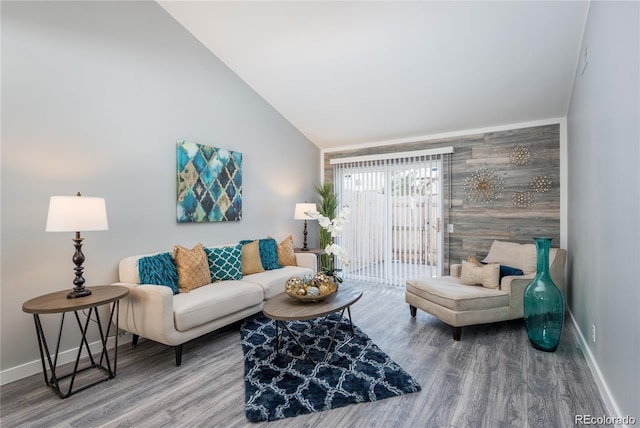 living room featuring hardwood / wood-style flooring and lofted ceiling