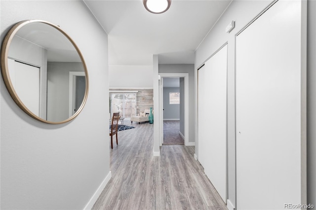 corridor featuring light hardwood / wood-style floors