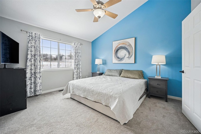 bedroom featuring carpet, vaulted ceiling, and ceiling fan