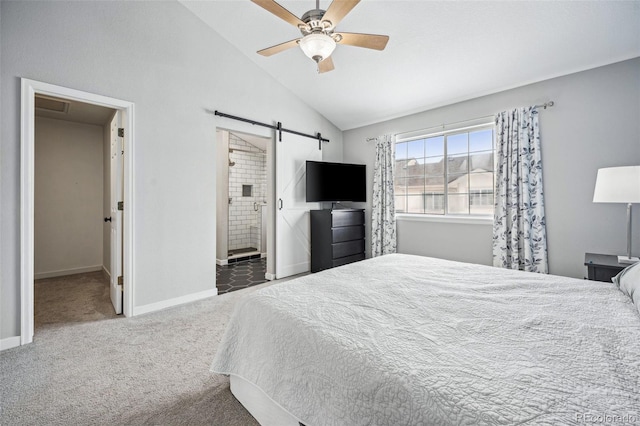 carpeted bedroom with lofted ceiling, ensuite bathroom, ceiling fan, and a barn door