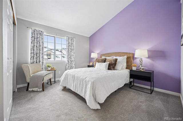 carpeted bedroom featuring lofted ceiling