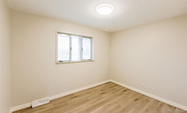 unfurnished room featuring light hardwood / wood-style flooring