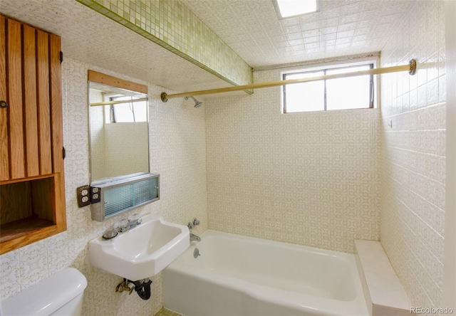 full bathroom with shower / washtub combination, sink, and toilet