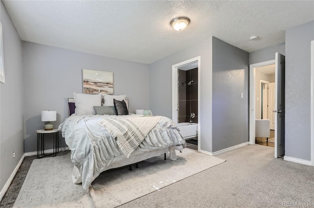 carpeted bedroom with a textured ceiling and baseboards