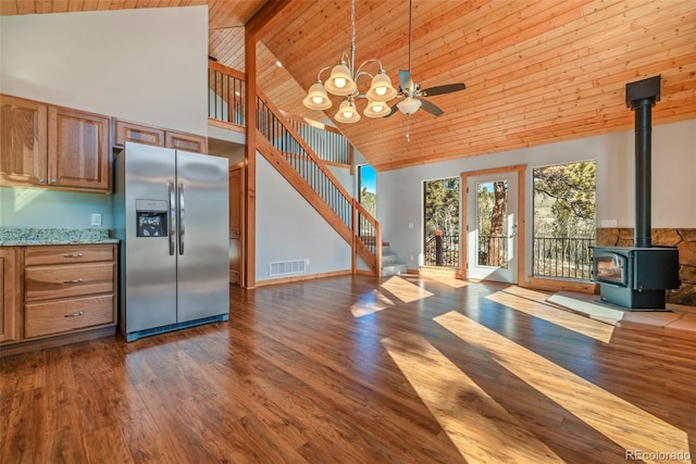 1840 Ute Trl, Como, CO 80432 - unfurnished living room with stairway, high vaulted ceiling, a wood stove, wood ceiling with exposed beams, and wood finished floors