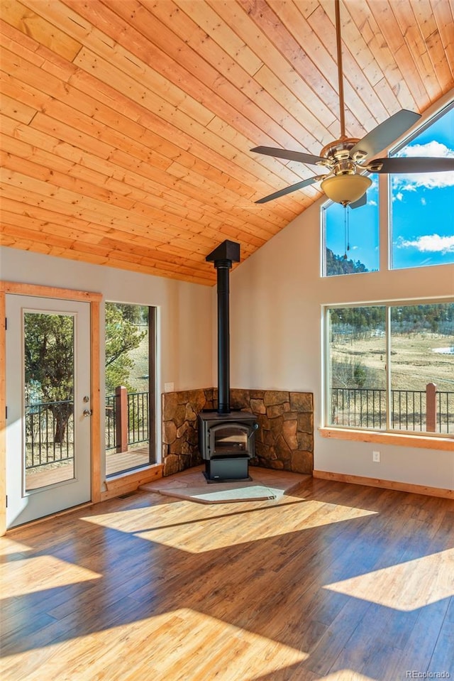 1840 Ute Trl, Como, CO 80432 - unfurnished living room featuring wood ceiling, vaulted ceiling, a wood stove, a ceiling fan, and wood finished floors