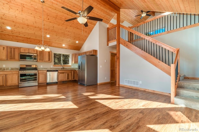1840 Ute Trl, Como, CO 80432 - kitchen featuring appliances with stainless steel finishes, a ceiling fan, high vaulted ceiling, light countertops, and a chandelier
