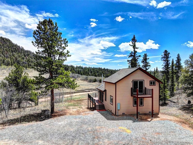 1840 Ute Trl, Como, CO 80432 - view of side of property featuring a balcony and a wooded view