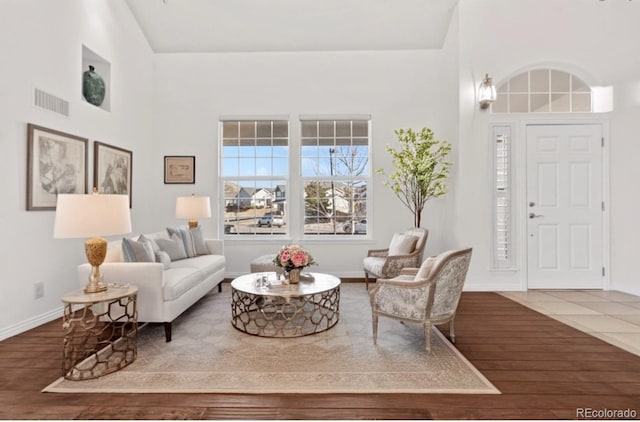 living room featuring hardwood / wood-style flooring and lofted ceiling