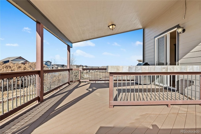 wooden deck with a grill