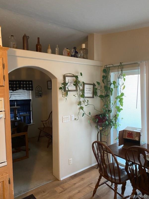 dining room with hardwood / wood-style flooring