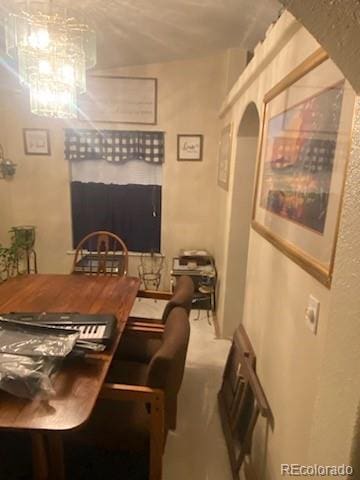 dining space featuring an inviting chandelier