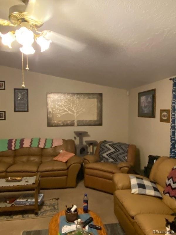 living room featuring carpet floors and vaulted ceiling