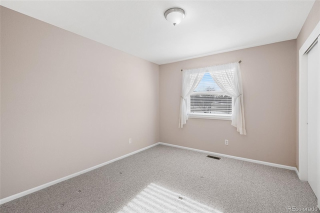 unfurnished bedroom featuring a closet and carpet