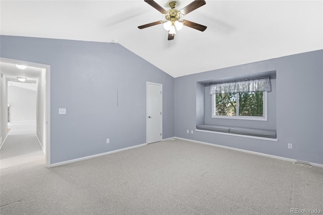 interior space featuring lofted ceiling, carpet floors, and ceiling fan