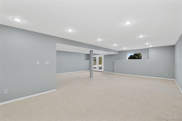 basement featuring light colored carpet