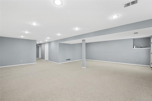 basement featuring light carpet