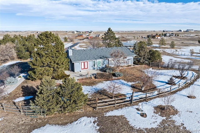 snowy aerial view featuring a rural view