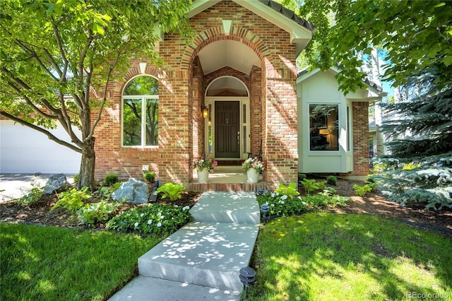74 Blue Heron Dr, Greenwood Village, CO 80121 - property entrance featuring brick siding and a garage