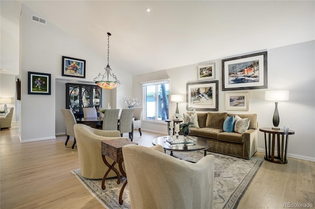 74 Blue Heron Dr, Greenwood Village, CO 80121 - living room with light wood-style flooring and high vaulted ceiling