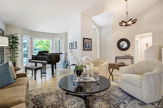 74 Blue Heron Dr, Greenwood Village, CO 80121 - living area featuring light wood-style flooring, a chandelier, and high vaulted ceiling
