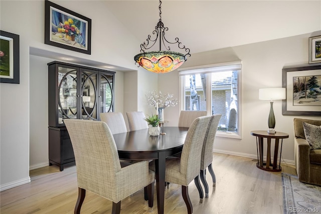 74 Blue Heron Dr, Greenwood Village, CO 80121 - dining area with light wood-type flooring and high vaulted ceiling