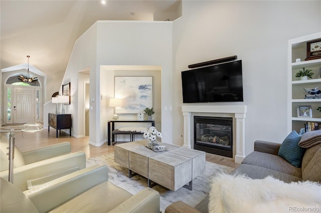 74 Blue Heron Dr, Greenwood Village, CO 80121 - living area with light wood finished floors and a glass covered fireplace