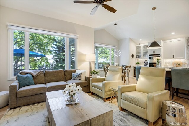 74 Blue Heron Dr, Greenwood Village, CO 80121 - living area with ceiling fan, vaulted ceiling, recessed lighting, and light wood-type flooring