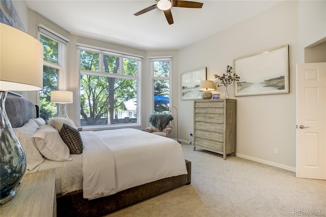 74 Blue Heron Dr, Greenwood Village, CO 80121 - bedroom with multiple windows, carpet, and ceiling fan