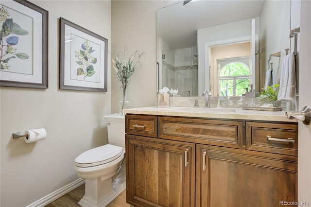 74 Blue Heron Dr, Greenwood Village, CO 80121 - bathroom with vanity, a stall shower, and wood finished floors