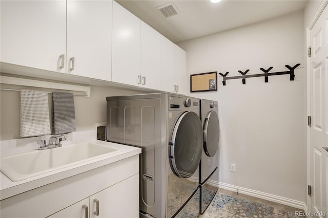 74 Blue Heron Dr, Greenwood Village, CO 80121 - laundry area featuring cabinet space and separate washer and dryer