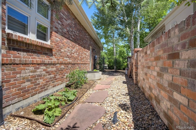74 Blue Heron Dr, Greenwood Village, CO 80121 - view of side of home featuring brick siding