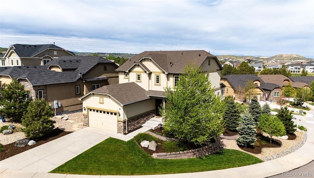 2115 Holmby Ct, Castle Rock, CO 80104 - view of front facade featuring a residential view, stucco siding, driveway, stone siding, and a front yard